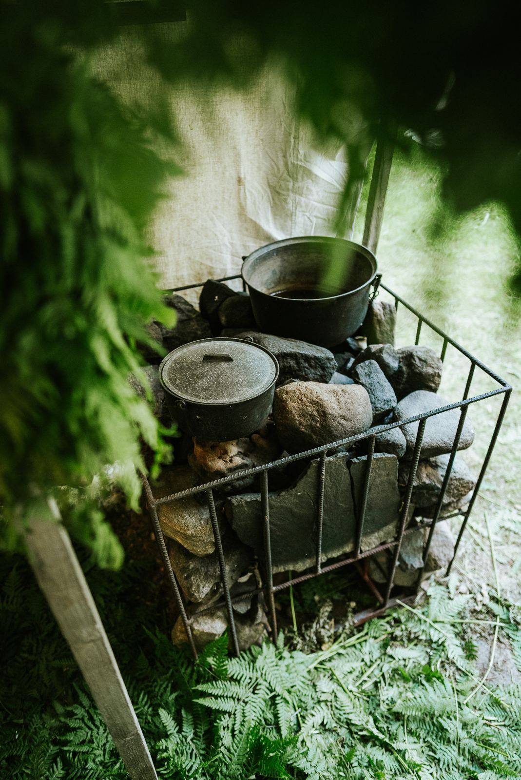 Sauna stove stones with cast-iron pots